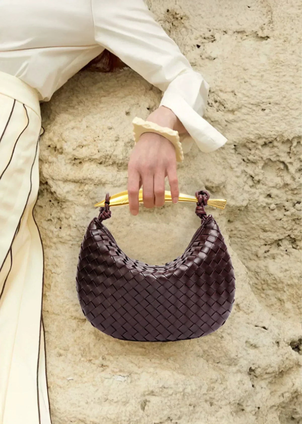 Minerva gold-tone bar woven crescent top-handle bag