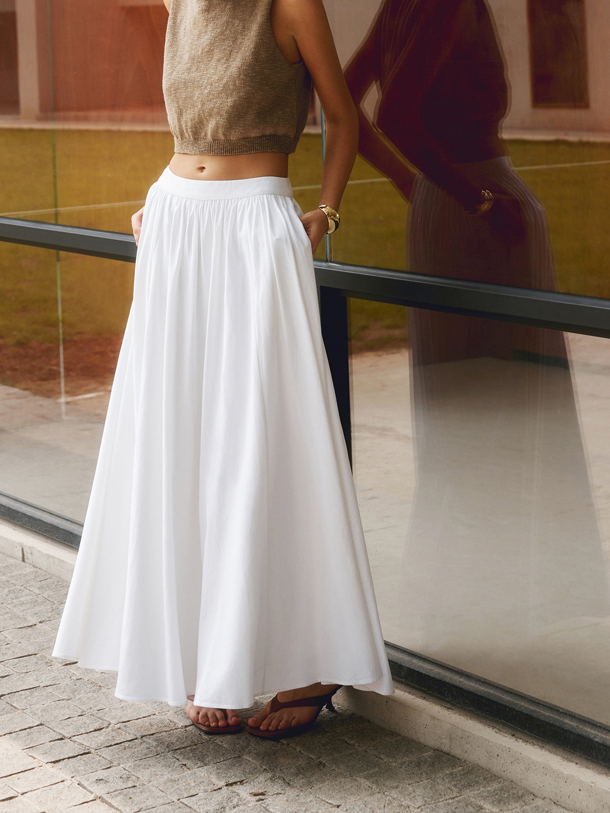 Noor high-waisted pleated a-line maxi skirt