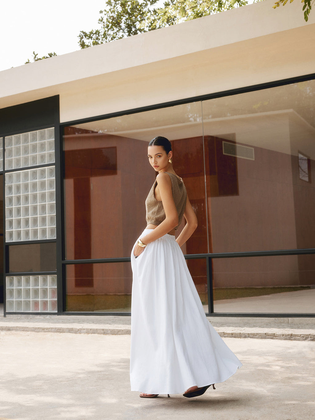 Noor high-waisted pleated a-line maxi skirt