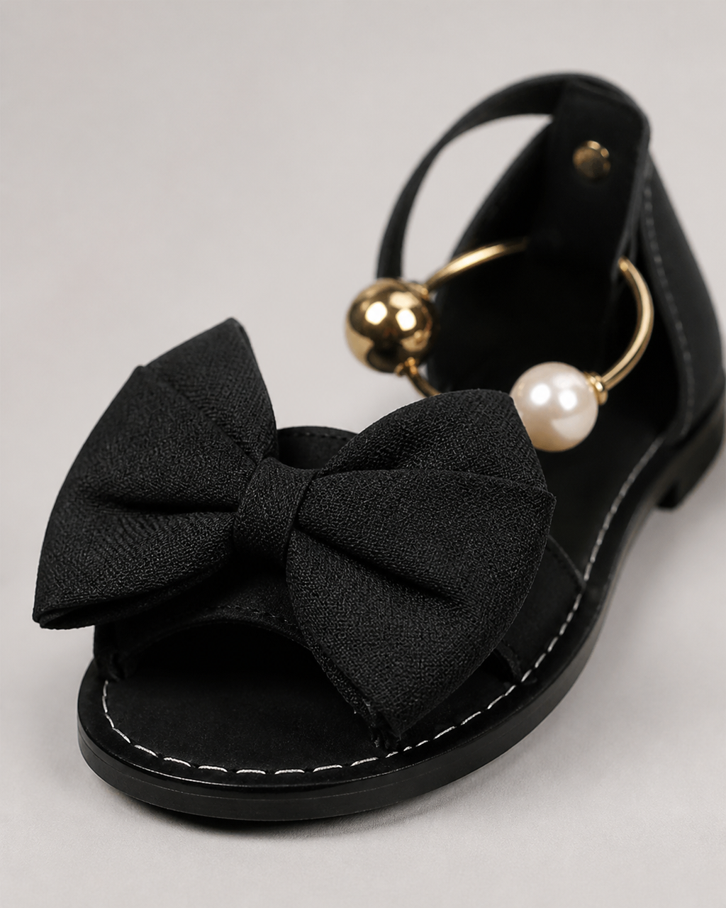 Corwyn Bow Flat Sandals | Women's Pearl Ankle-Cuff Sandals — Black — macro